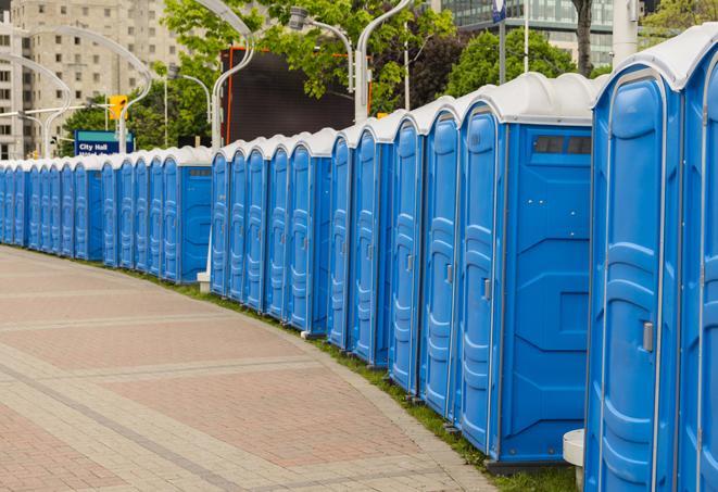 a row of portable restrooms at a fairground, offering visitors a clean and hassle-free experience in hardin